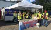 Rotary Club of Sioux Lookout members prepare to welcome guests at last year’s Lobster Sale.     Photo Courtesy Sylvie MacDonald