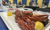  Guests at this year’s Rotary Lobsterfest could choose between lobster or rib dinners.   Tim Brody / Bulletin Photo
