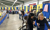 Rotary Lobsterfest guests check out the silent auction and penny auction items donated for the fundraising event.    Tim Brody / Bulletin Photo