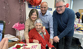 Mrs. Luigina Bastone with three of her four children, Erminia Maykut (standing left), Frank Bastone (standing centre), and John Bastone (standing right). Missing from photo is daughter Maria Tripney.     Tim Brody / Bulletin Photo