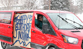 Susan Hochstedler wishes Luigina Bastone a happy 95th birthday as she and her husband drive by. - Tim Brody / Bulletin Photo