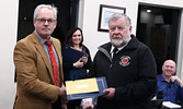 Mayor Doug Lawrance (left) presents Dennis Leney with a Municipal Employee Recognition Award recognizing his 40 years as a volunteer firefighter. - Tim Brody / Bulletin Photo