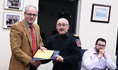 Mayor Doug Lawrance (left) presents Fire Chief Rob Favot with a Municipal Employee Recognition Award recognizing his 45 years with the volunteer fire department.  - Tim Brody / Bulletin Photo