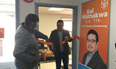 Mamakwa (centre), assisted by Chisel, cuts a ribbon to officially open his Sioux Lookout constituency office.  - Tim Brody / Bulletin Photo