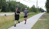 Event participants run along the Umfreville Trail.    Tim Brody / Bulletin Photo