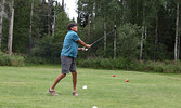 Rick Angeconeb watches his shot soar down the fairway. - Tim Brody / Bulletin Photos