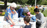 Linda Bancroft (left) assists event participants.    Tim Brody / Bulletin Photo