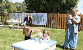 Children play with bubbly water during the event.    Tim Brody / Bulletin Photo