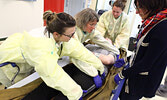 From left: Dr. Evangelie Mosconas, Dr. Alice Gwyn, Michelle Bertrand, RPN, and Dr. Julie Caron “provide care” for “crash victim” Eric Goretzki. - Tim Brody / Bulletin Photo