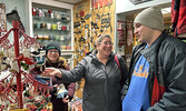 From left: Shannon Brody, Nancy Grenier, and Bradley Grenier check out the selection at Cheers! Flowers and Gifts.   Tim Brody / Bulletin Photo