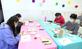 Participants at the Mother’s Day Tea and Paint event.    Tim Brody / Bulletin Photo