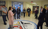 Michelle Hrynchuk (foreground, left), along with Laurence Hay, led groups of NOSM board members on tours of the Sioux Lookout Meno Ya Win Health Centre during the board retreat. - Jesse Bonello / Bulletin Photo