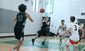 The Sioux North High School Senior Boys Basketball Team (the Warriors) in action against the visiting Westgate Collegiate and Vocational Institute Senior Boys Basketball Team (the Tigers) in game two of the NWOSSA “AA” Basketball Championship.   Tim Brody