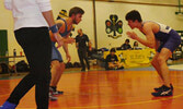 SNHS wrestler Levi Melnichuk (left) sizes up his adversary. - Rob Sakamoto / Submitted Photo