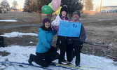 Makayla Hoftyzer with her mother Marilese Keller (left) and father Paul Hoftyzer (right) last Wednesday after completing the final kilometres of the 400km she skied during the months long ski challenge.   Reeti Meenakshi Rohilla / Bulletin Photo