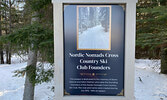 Signage located at the entrance to the ski trail at the Cedar Bay parking lot pays homage to the club’s founders.    Tim Brody / Bulletin Photo