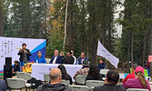 Margaret Kenequanash, CEO of Wataynikaneyap Power (standing at microphone) speaks at a celebration for the energization of North Caribou Lake First Nation.   Image courtesy of Wataynikaneyap Power