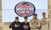 From left: SNHS wrestling coach Rob Sakamoto, wrestler Evan Burch, wrestler Carlos Mattinas, and wrestling coach Craig Burch.   Photo courtesy of Sioux North High School