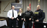 From left: OPP North West Region Chief Superintendent/Regional Commander Bryan MacKillop presents Commissioners Commendations to Detective Constable Haley Collinson, Provincial Constable Lucas Wolfe, and Detective Constable Matthew Evans.   Tim Brody / Bu