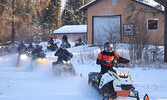 Snowmobilers take off behind the OPTA Clubhouse as they start their Snowarama 2019 ride. - Jesse Bonello / Bulletin Photo