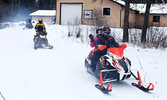 Snowmobilers set out from the OPTA clubhouse in 2017. - Bulletin File Photo