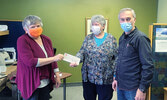 Susan Barclay, (left) Executive Director of Sioux Lookout Out of the Cold shelter , accepts a cheque from the Ontario Realtors Care Foundation from Pat Abela (centre) and Nate Hochstetler (right), Brokers with Sioux Mountain Realty. The cheque, in the amo