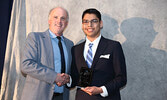 Teacher Barry McLoughlin presents Philip Howe with the Male Literacy Award. - Tim Brody / Bulletin Photo