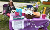 Twylla Penner, PAIL Network regional representative, with resources for event participants.   Tim Brody / Bulletin Photo