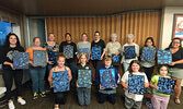 Participants of the Blueberry Theme Painting Tutorial show off their finished artwork.   Photo courtesy of Twylla Penner