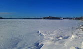 Pelican Lake lies frozen under a blanket of snow. The official date of this year’s freeze-up was Dec 5, despite a milder than usual November.     Mike Lawrence / Bulletin Photo