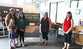 From left: Vanessa Berry and her children Ameera and Brooklyn Swartz accept first price in the Sioux Lookout Chamber of Commerce’s Take Pride Community Wide Competition from Chamber President Katie Positano and Chamber Director Dori Hopko. - Tim Brody / B