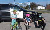 Hudson (left) and Matilda Hummelen holding their positive tickets given out by Sioux Lookout OPP Constable Samantha Lee (right).            Ruben Hummelen / Submitted Photo