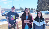 From left: Mitch Simmons (PFFNHS staff member), Joanna Quequish (grade 10 student), and Penelope Roundhead (Grade 12 student) worked tirelessly to keep the sacred fire lit just outside of PFFNHS. - Jesse Bonello / Bulletin Photo