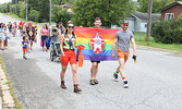LGBTQ2S+ Pride Celebration Parade participants walk through the downtown to the Town Beach.   Tim Brody / Bulletin Photo
