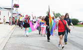 Devin Rosemin (foreground, carrying Pride flag) and other participants in this year’s LGBTQ2S+ Pride Celebration Parade march down Front Street to the Town Beach.     Tim Brody / Bulletin Photo