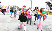 LGBTQ2S+ Pride Celebration Parade participants walk through the downtown to the Town Beach.   Tim Brody / Bulletin Photo