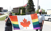 Jason Duewel (left) and Sioux Lookout Mayor Doug Lawrance pose for a photo with the Pride Flag before it is raised at the Sioux Lookout Municipal Office on June 1.     Tim Brody / Bulletin Photo