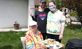 Kaitlin Sanders (left) and Amey Legere (right) pose for a photo with St. Andrew’s United Church member Aileen Urquhart (seated).  St. Andrew’s United Church and the Sioux Lookout Community Gay Straight Alliance invited community members to celebrate Pride