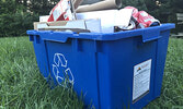 Many residents are already starting to use their blue recycling bins. Clear and blue plastic bags will continue to be accepted throughout the month of August for putting out recycling. - Tim Brody / Bulletin Photo