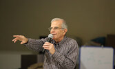 Merle Burkholder conducts the live auction.   Tim Brody / Bulletin Photo