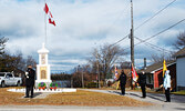 Accompanied by the colour guard, Master of Ceremonies Reg Drew, Medal of Military Merit (MMM), Canadian Forces Decoration (CD) led a shortened Remembrance Day service at the cenotaph in Hudson for Candlish Memorial, Branch #139, Royal Canadian Legion. - P