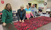 Volunteers in Hudson put together this year’s Remembrance Day poppy displays.    Photo courtesy of Dorothy Broderick