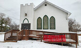 Poppies adorn the front of a church by the cenotaph in Hudson.   Photo courtesy of Dorothy Broderick