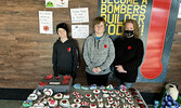 From left: Christopher, Donovan, and Nancy McCord were at Fresh Market Foods last Saturday selling Remembrance Day themed painted rocks for donations to help local veterans.   Tim Brody / Bulletin Photo