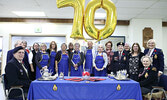 Legion Ladies Auxiliary members, joined by Legion First Vice-President John Cole (seated left), and Lew Morgan (standing centre). The Legion Ladies Auxiliary celebrated their 70th anniversary this year. - Tim Brody / Bulletin Photos