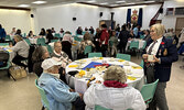 Legion Ladies Auxiliary President Charron Sippola (standing, right) chats with guests at last Saturday’s Remembrance Day Tea.   Tim Brody / Bulletin Photo