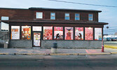 The Nishnawbe-Gamik Friendship Centre (left) and Sioux Area Seniors Activity Centre commemorate veterans with special window displays. - Tim Brody / Bulletin Photo