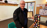 Ron Lemmon displays a plaque gifted to him by the OPTA in recognition of his years of volunteer service with the snowmobile club. - Photo Courtesy OPTA