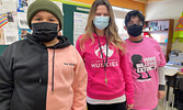 Sioux Mountain Public School students Layton Mekenak-Fontaine (right) and Nodin Brown (left) mark Pink Shirt Day with staff member Alicia MacMillan (centre).    Sioux Mountain Public School / Submitted Photo