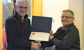 Rotarian Andreas Kottschoth (left) accepts his Paull Harris Fellow award from Rotary Club of Sioux Lookout President Kirk Drew.      Mike Lawrence / Bulletin Photos